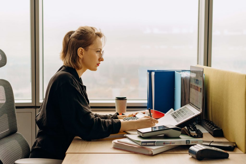 a woman preparing all her documents for a Tax Audit